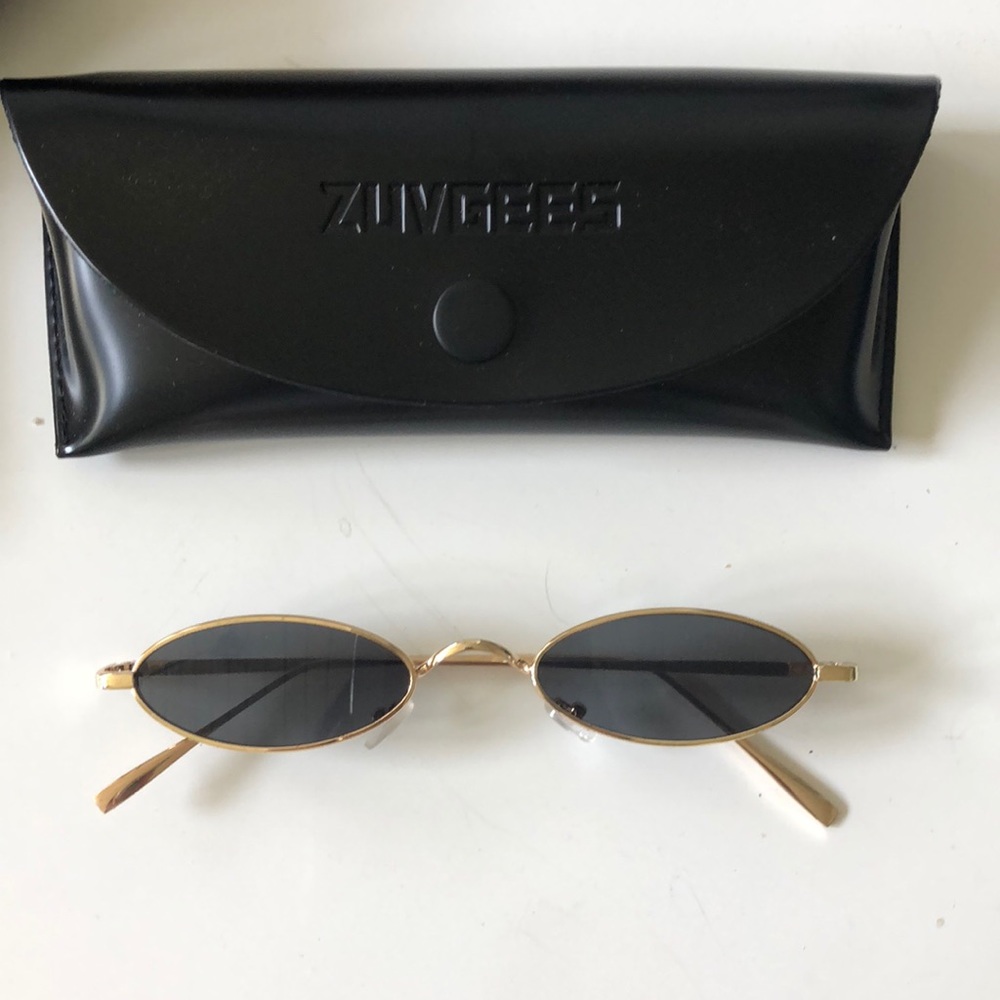 Thin oval gold metal sunglasses